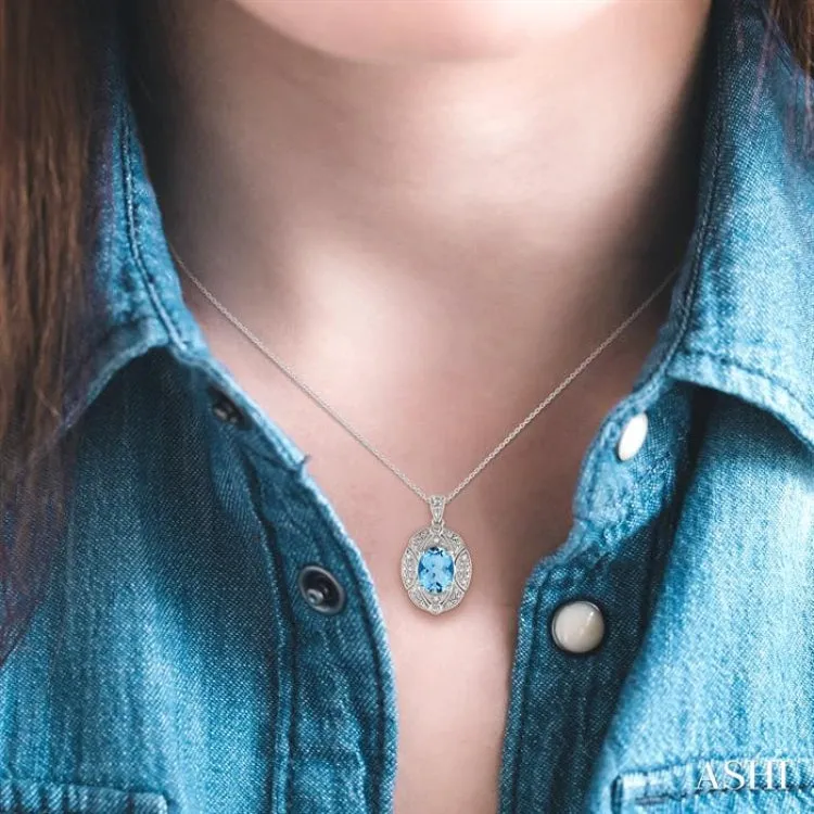 9x7 mm Oval Cut Blue Topaz and 1/50 ctw Single Cut Diamond Pendant in Sterling Silver with Chain