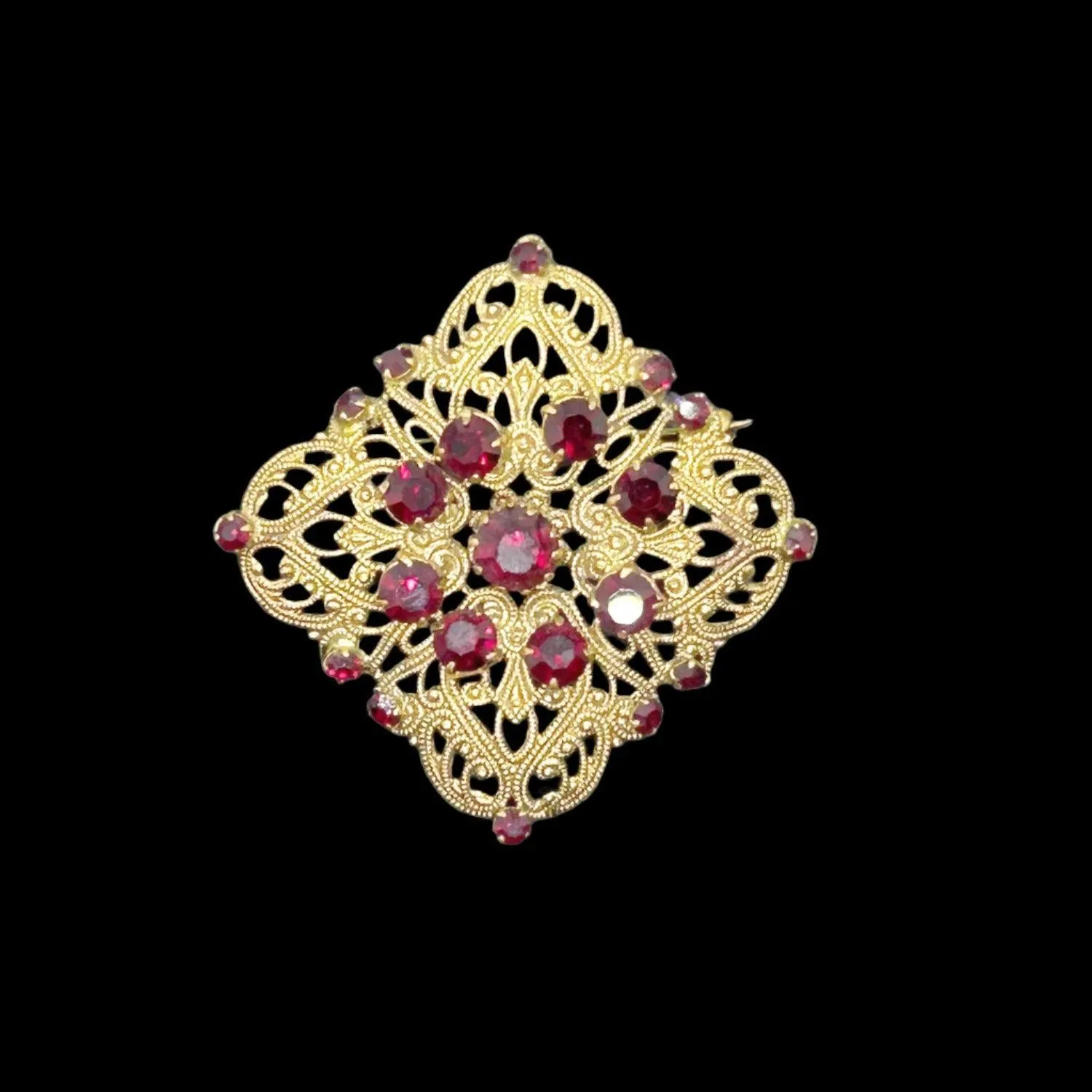 Intricate Vintage Gold Tone Brooch with Ruby Red Stones